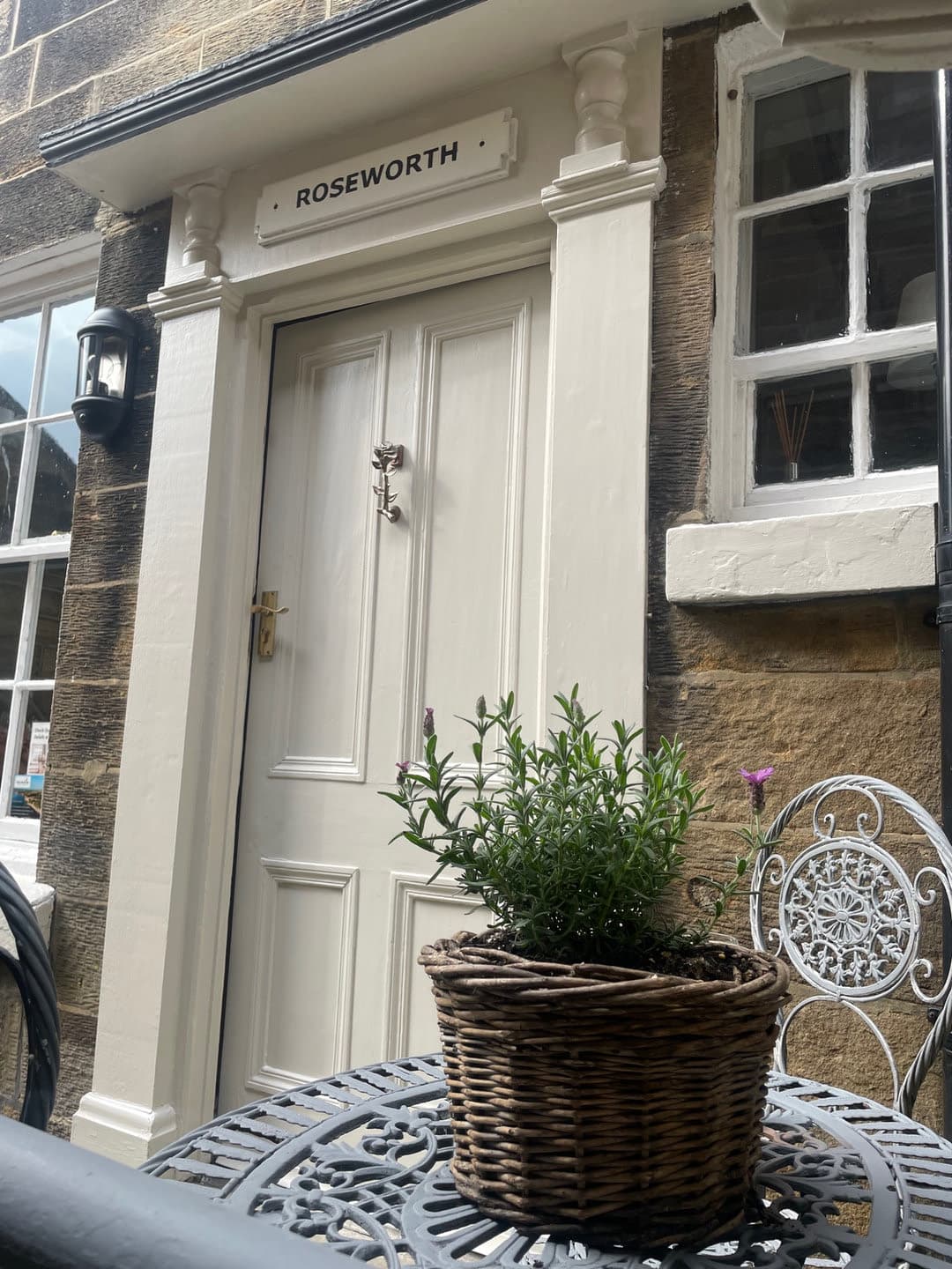 The front door with a wicker planter