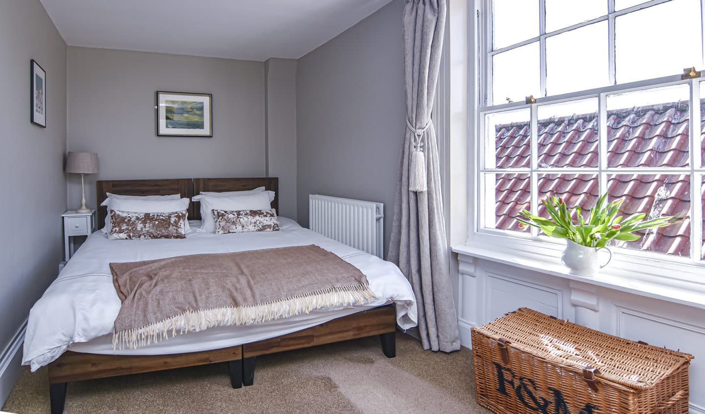 The double or twin bedroom beside its sash window