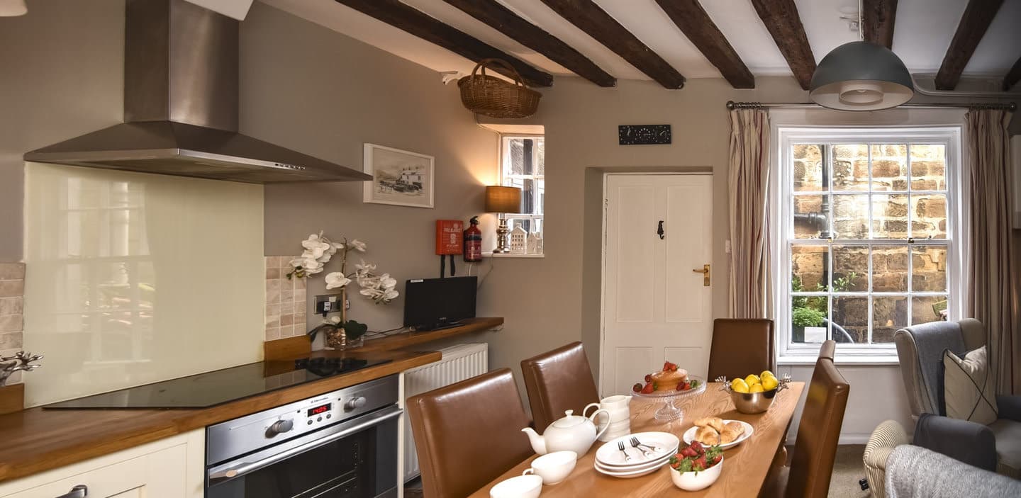 The dining kitchen and exposed beams
