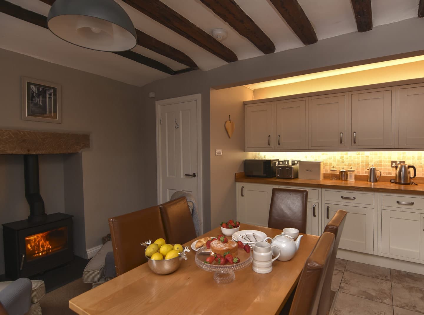 The kitchen dining table and wood burner