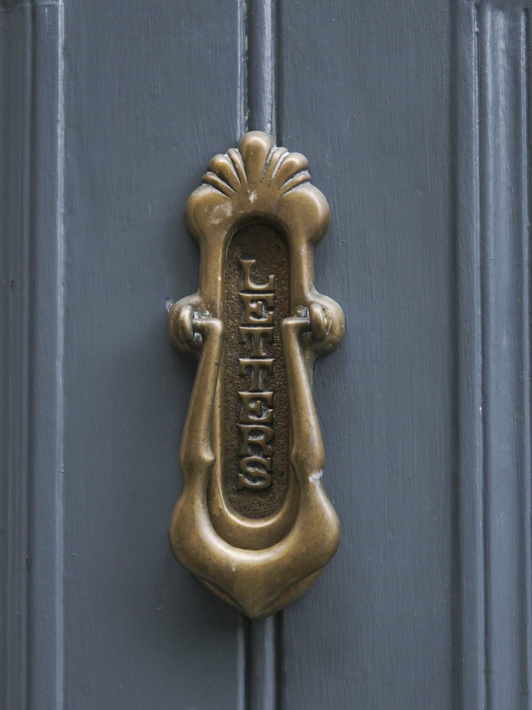 A decorative brass door knocker