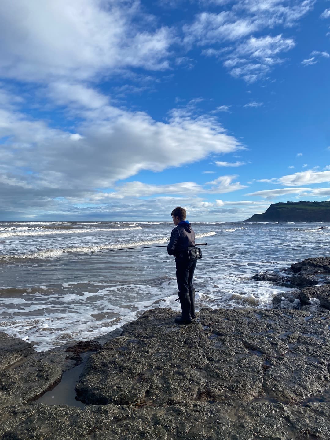 A visitor looking across the shore