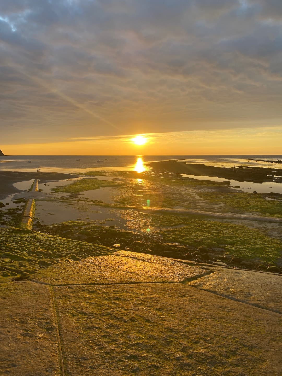 The setting sun over the open beach