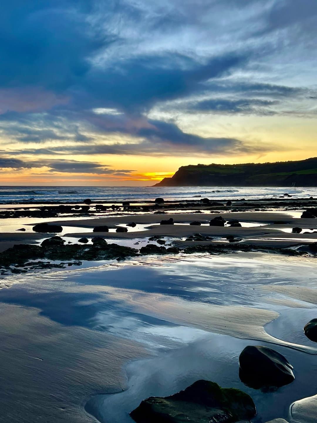 Blue and gold evening light across the tide pools