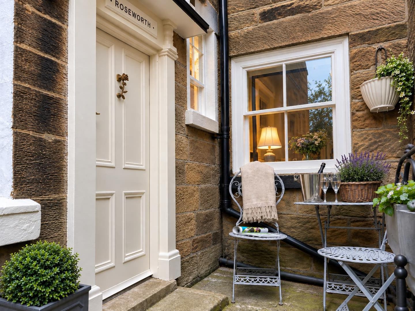 Roseworth rear entrance with a table set for an evening outside